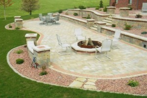 Patio with retaining walls, steps, firepit, seat walls, and pillars